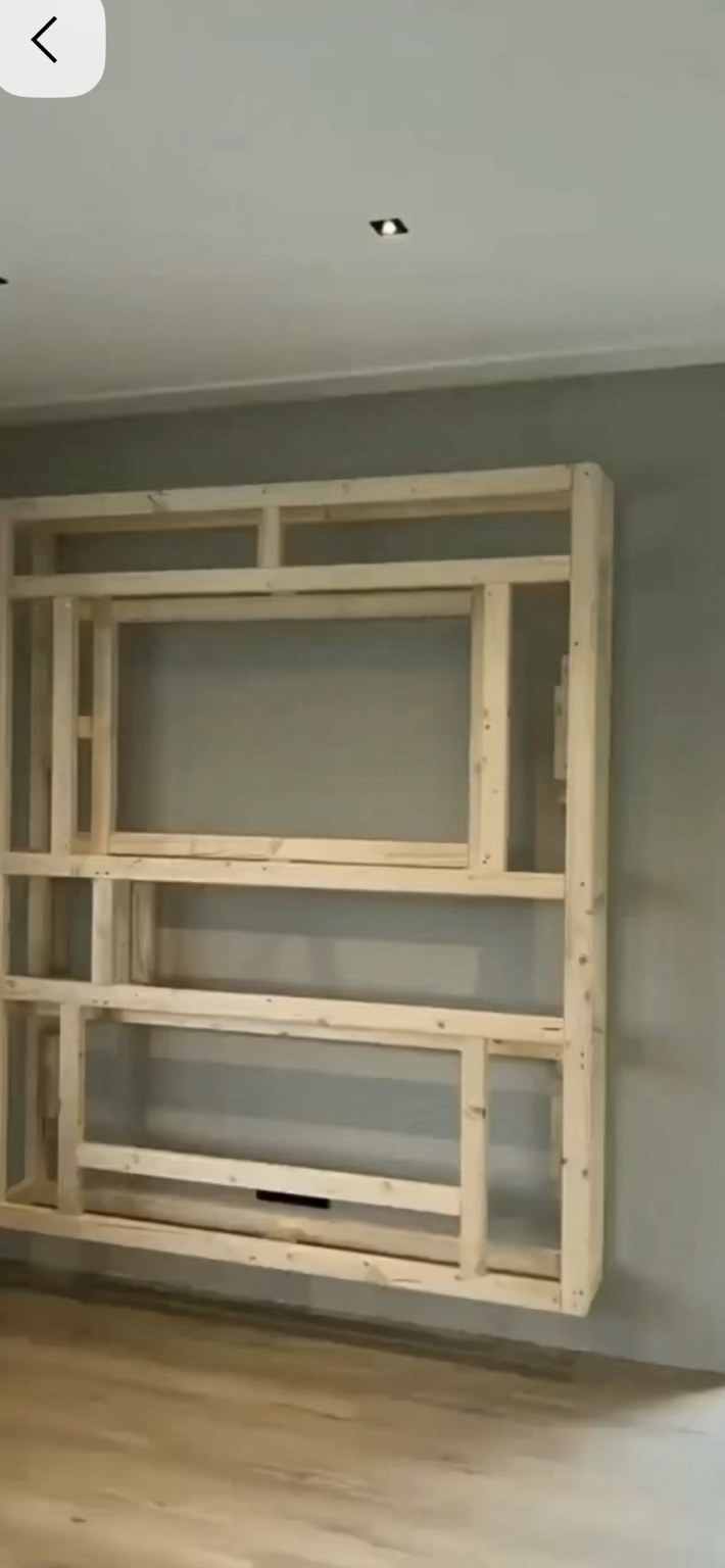 Custom fireplace and media wall during the carpentry framing stage