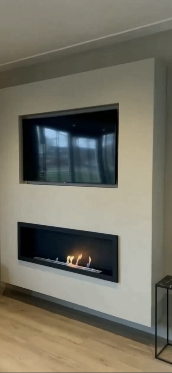 Completed modern media wall with recessed television and linear fireplace